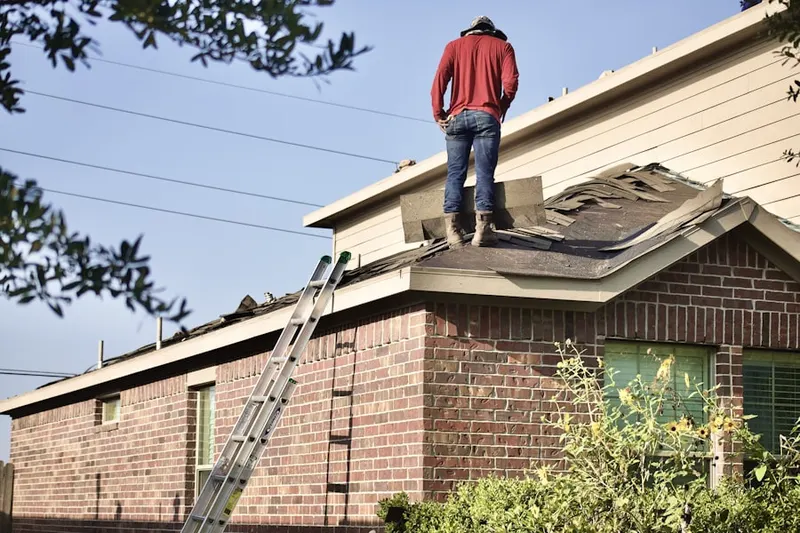 Professional roofer working on a residential roof in Rancho La Siesta Mobile Home Park
